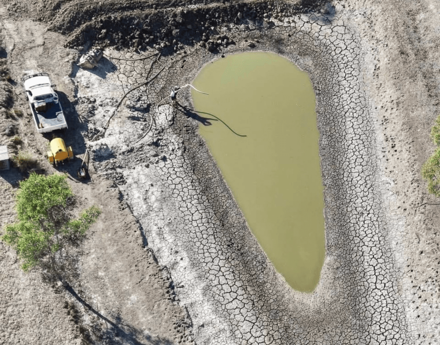 Aerial view of dam maintenance and pumping work on a rural property - Anderson & Sons earthworks